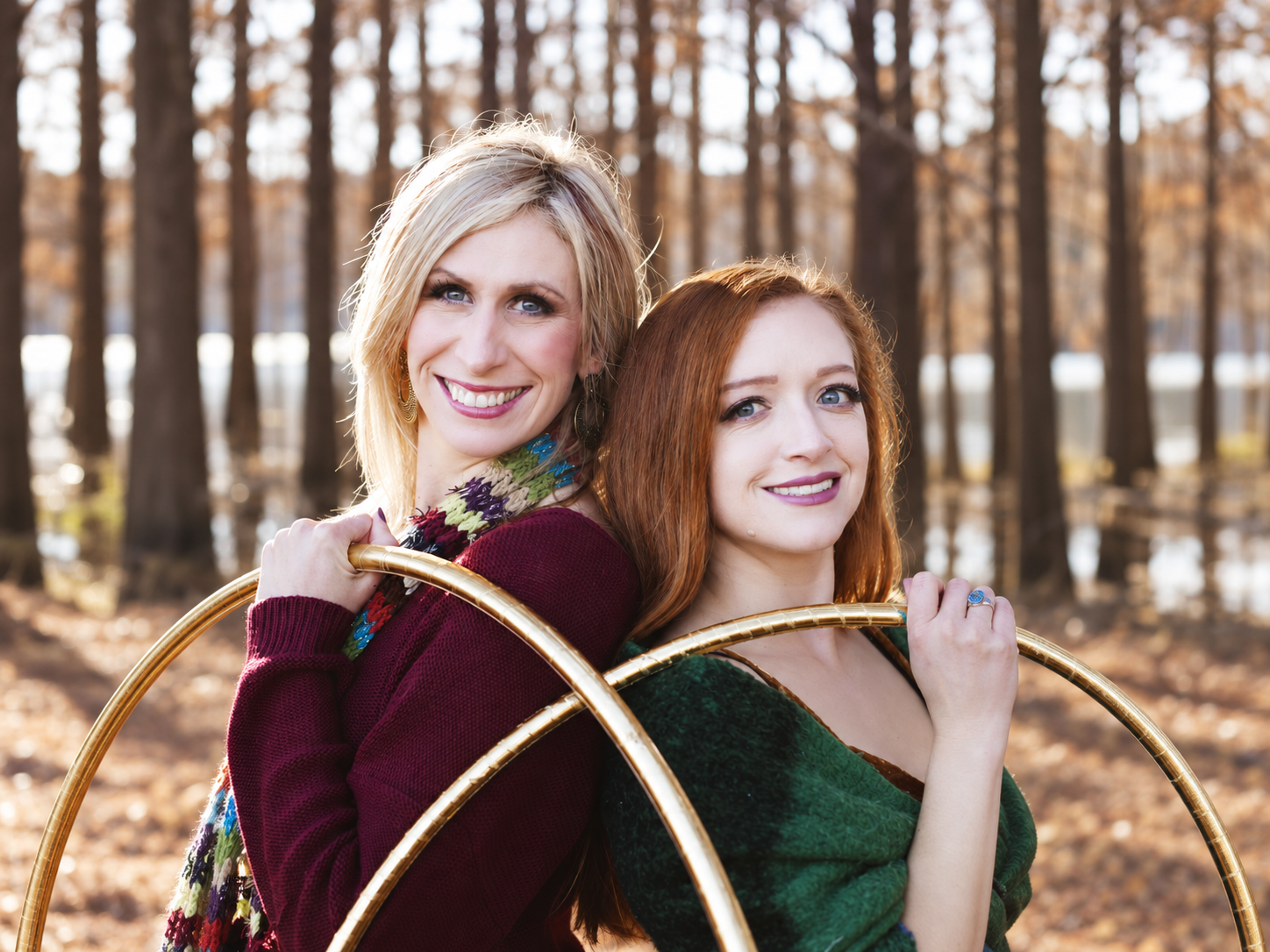 Michele McCoy and Hula Hooping Hannah smiling with gold hoops